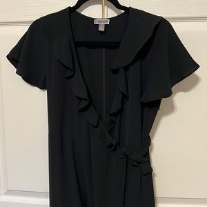 Black wrap dress with ruffle detail on collar and sleeves